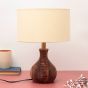 Unravel India "Matka Ribbed" sheesham wood table lamp with off-white shade