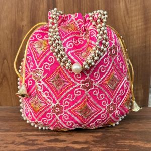 Unravel India Hot Pink Embroidered Potli Bag with Pearl Handle | Designer Ethnic Clutch for Women